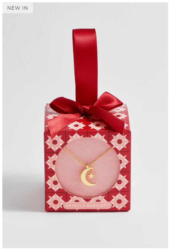 gold moon pendant in red festive packaging 