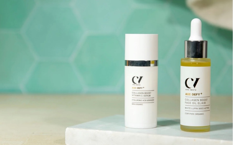 facial oil in bottle with blue background