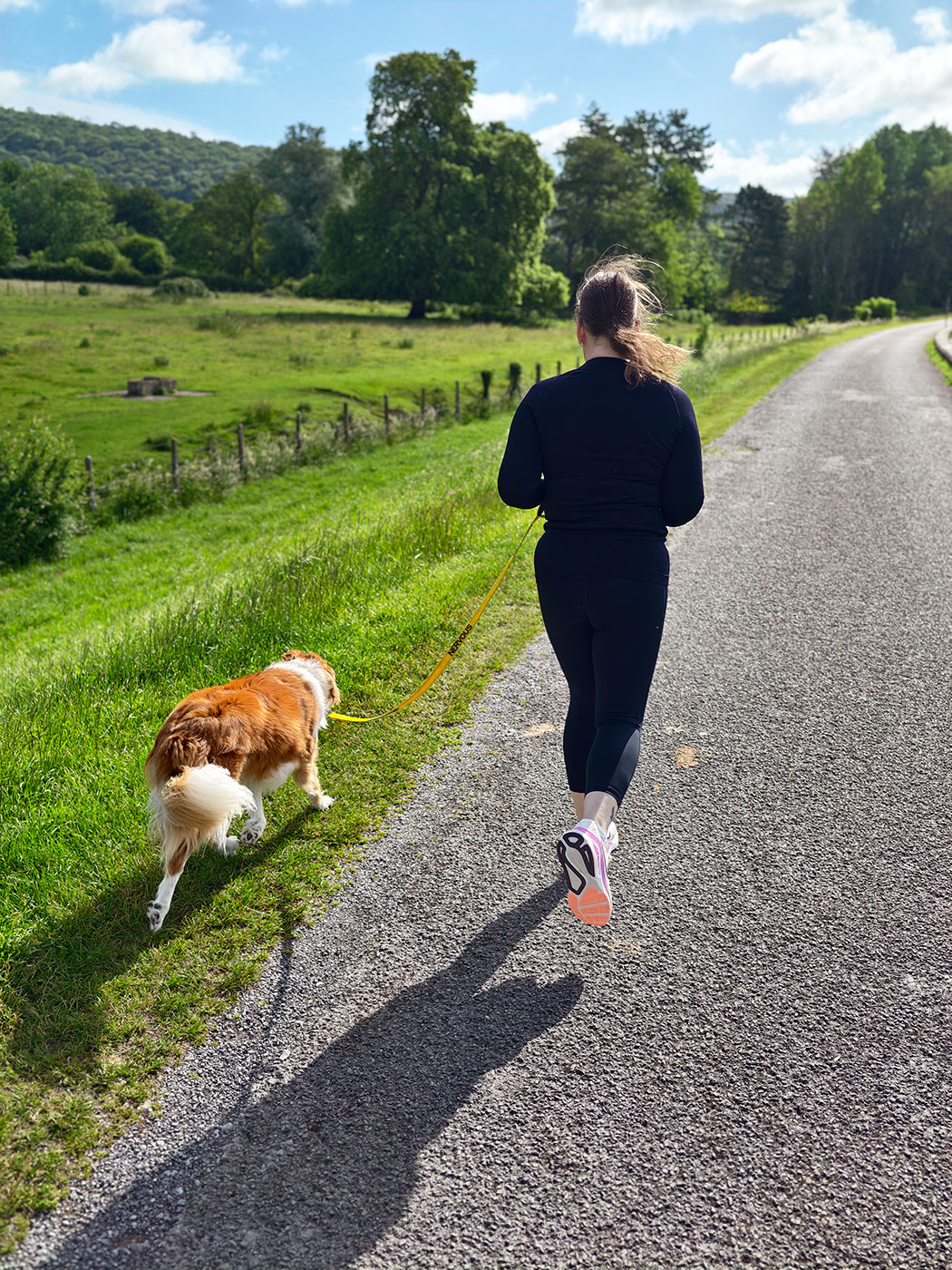 woman running with dog