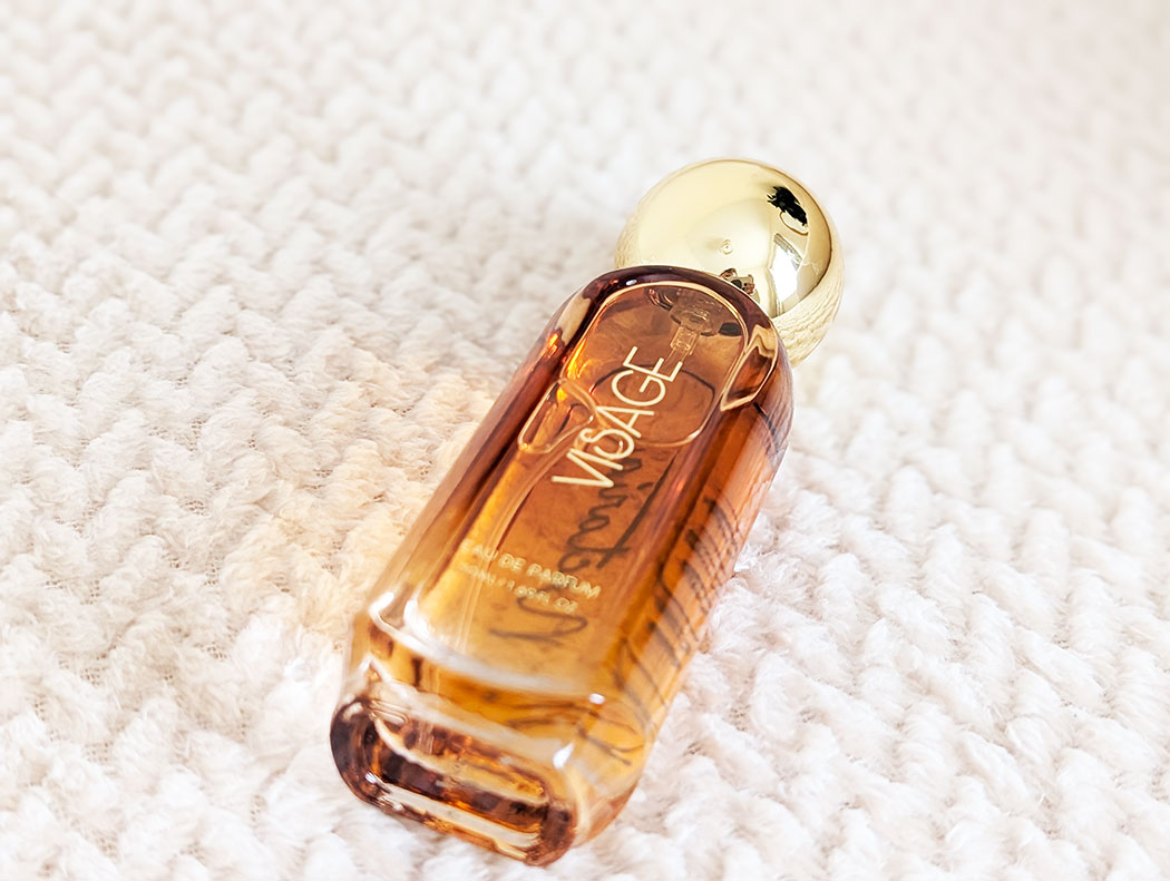 Visage perfume in bottle with gold lid