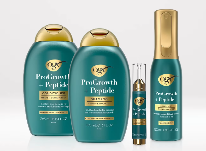 ogx peptide range in blue bottles with gold lids