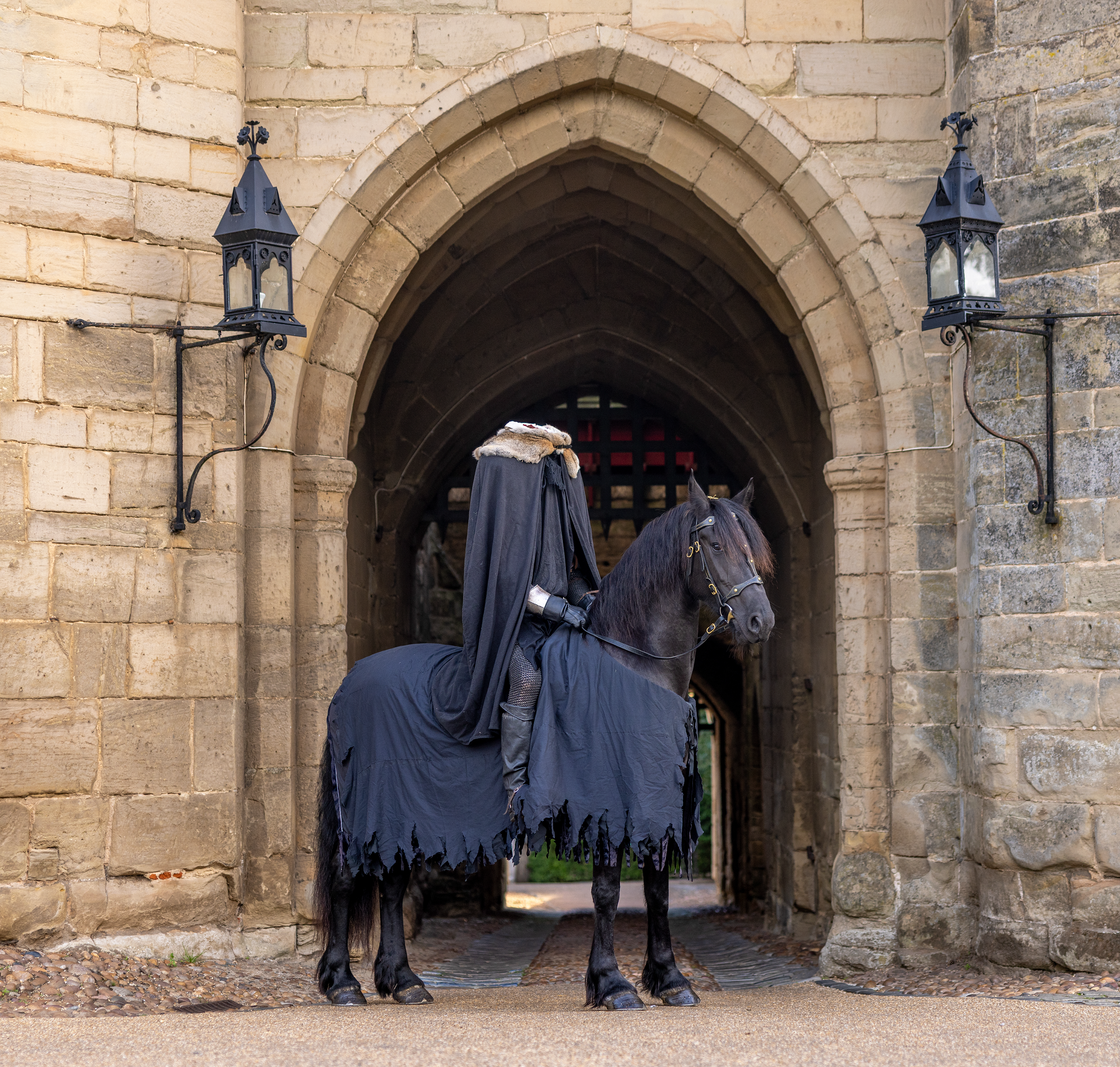 headless horseman outside castle gates