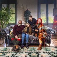 the strawbridge family pose on their sofa