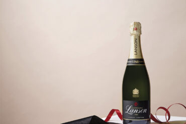 Lanson champagne styled image with red ribbon