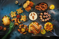 Spooky charcuterie board with ghosts made of cheese