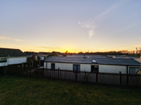 golden sands lodge with sunset in the background