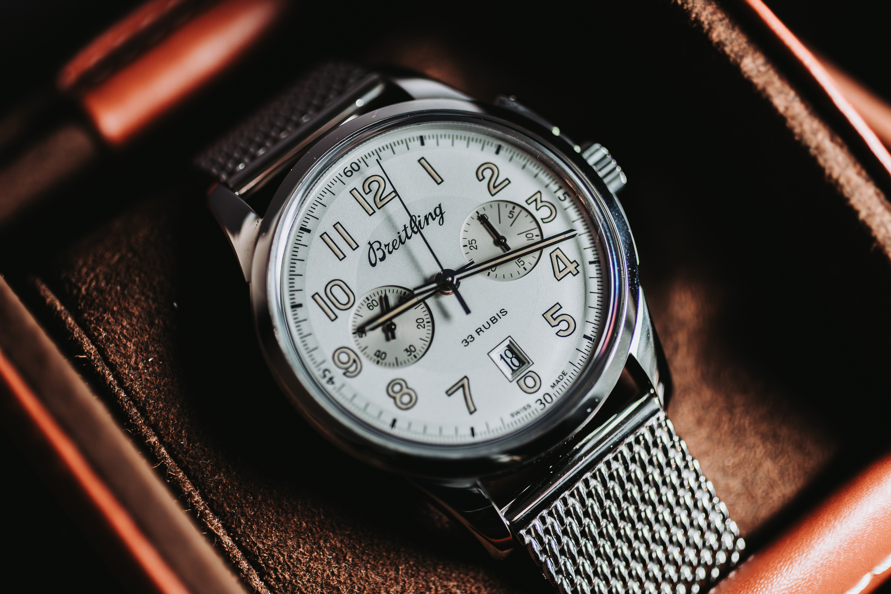 Men's silver watch in brown leather case