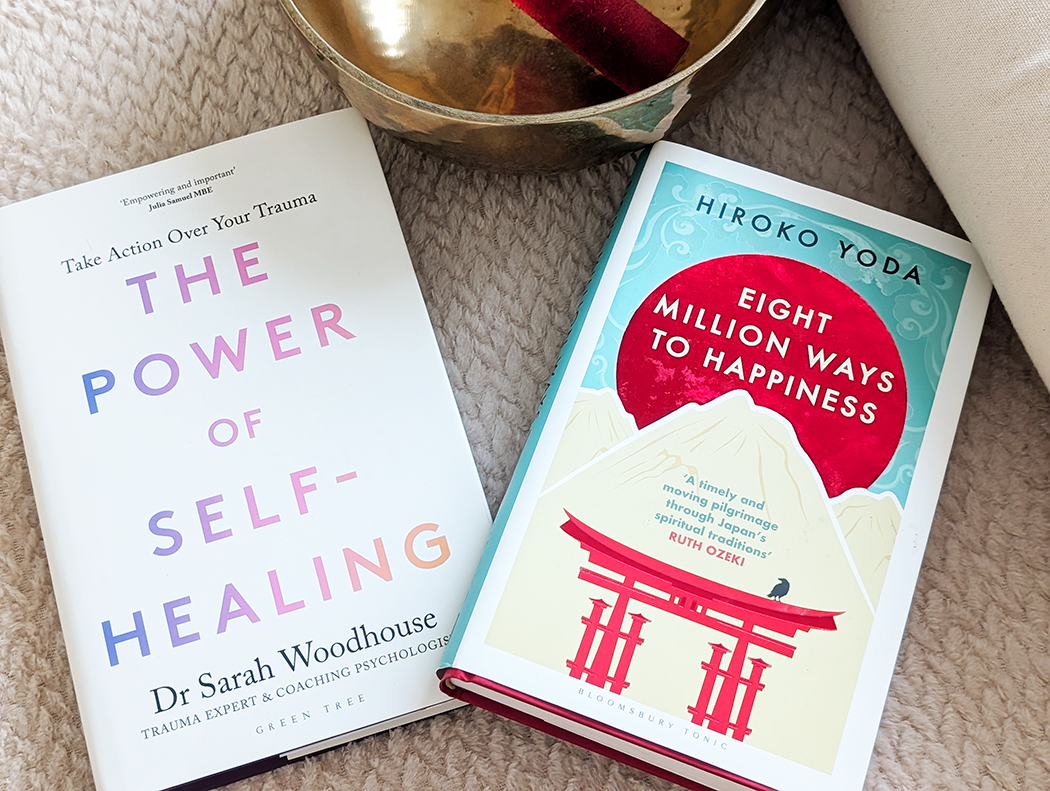 summer wellness books gift guide books on a bed